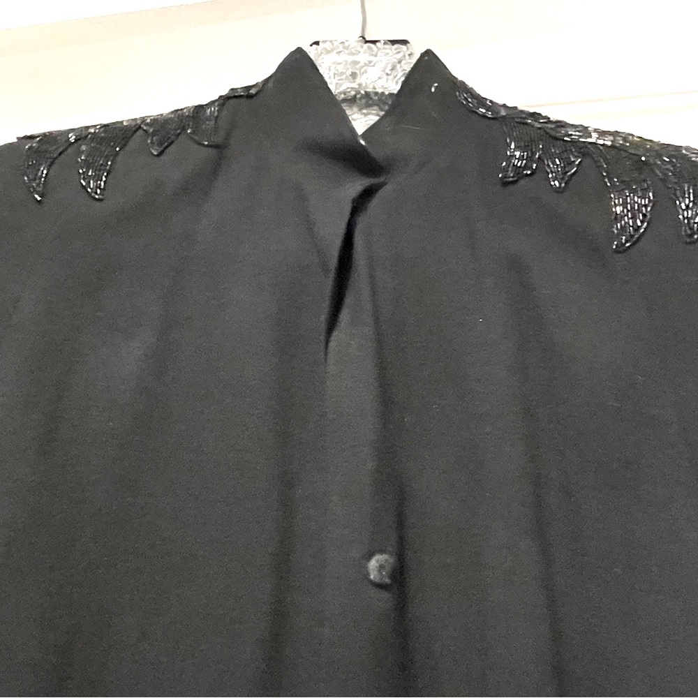 Vintage black wool cape with shoulder beading size S, dry clean.